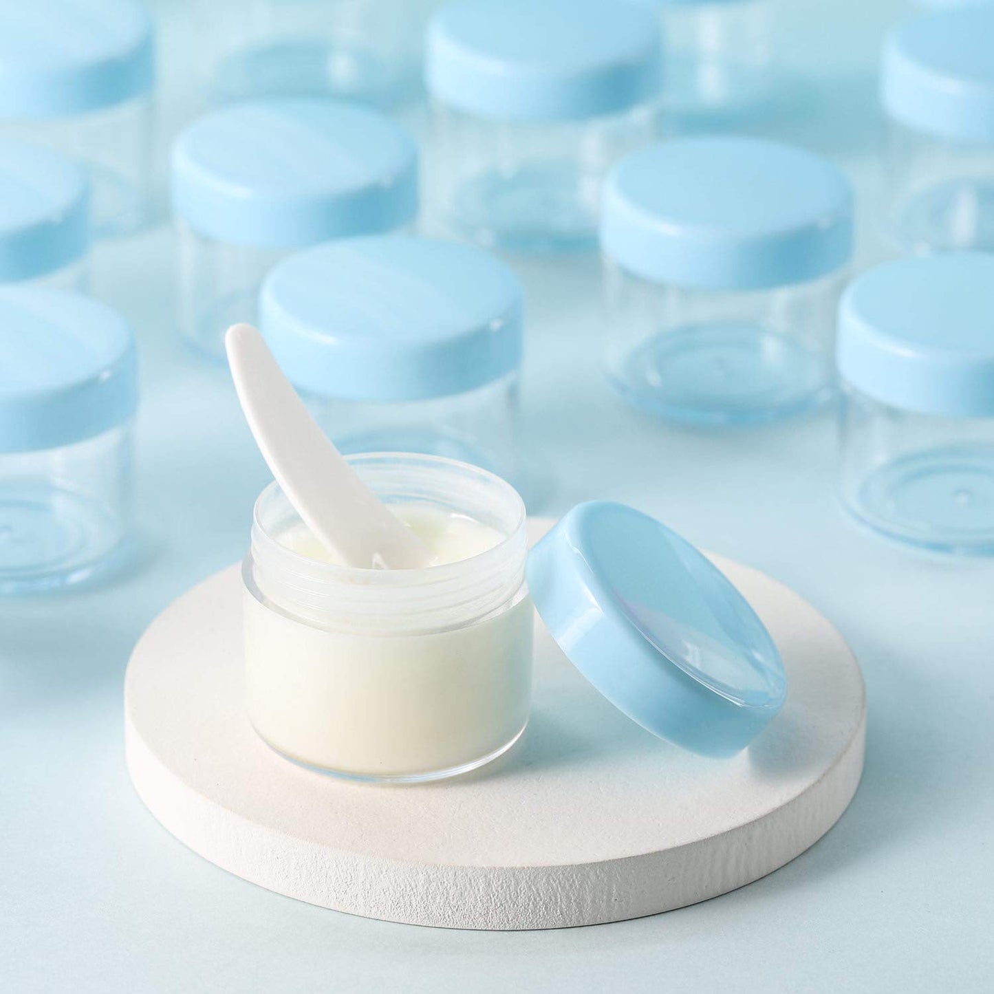 Refillable Cosmetic Sample Jars - 100 Pack 20g (0.7oz) Blue Small Travel Containers with Lids + 10 Mini Makeup Spatulas - BPA Free